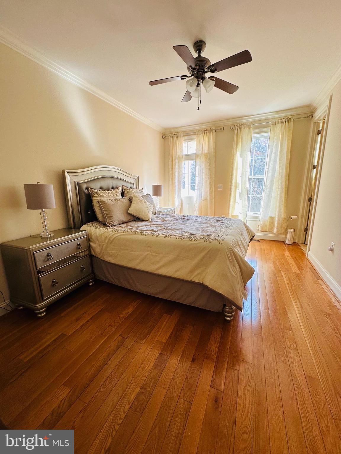 6413 Divine Street McLean, VA 22101 - Photo 44 of 60 a bedroom with a bed and wooden floor