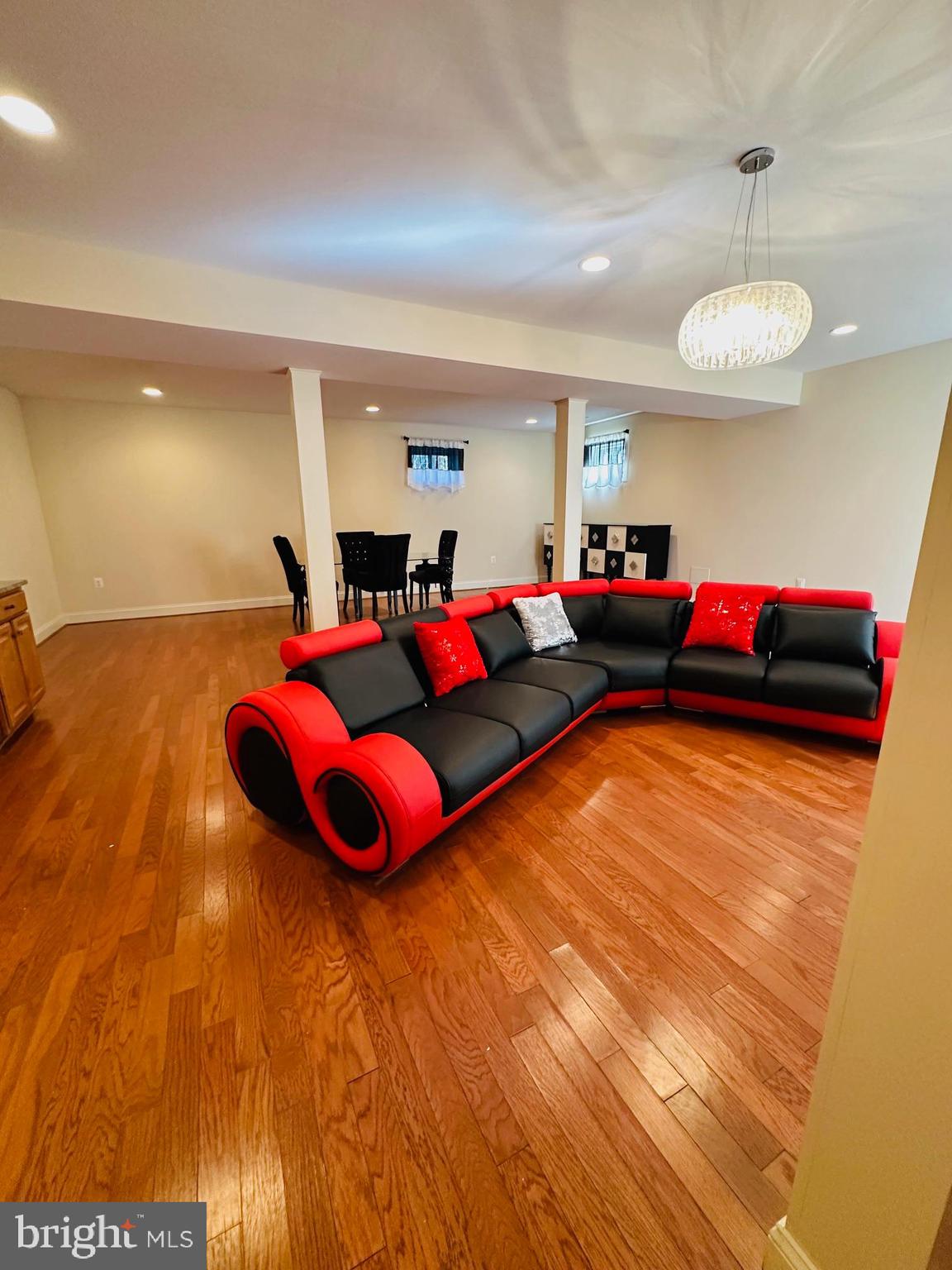 6413 Divine Street McLean, VA 22101 - Photo 48 of 60 a living room with furniture and a flat screen tv