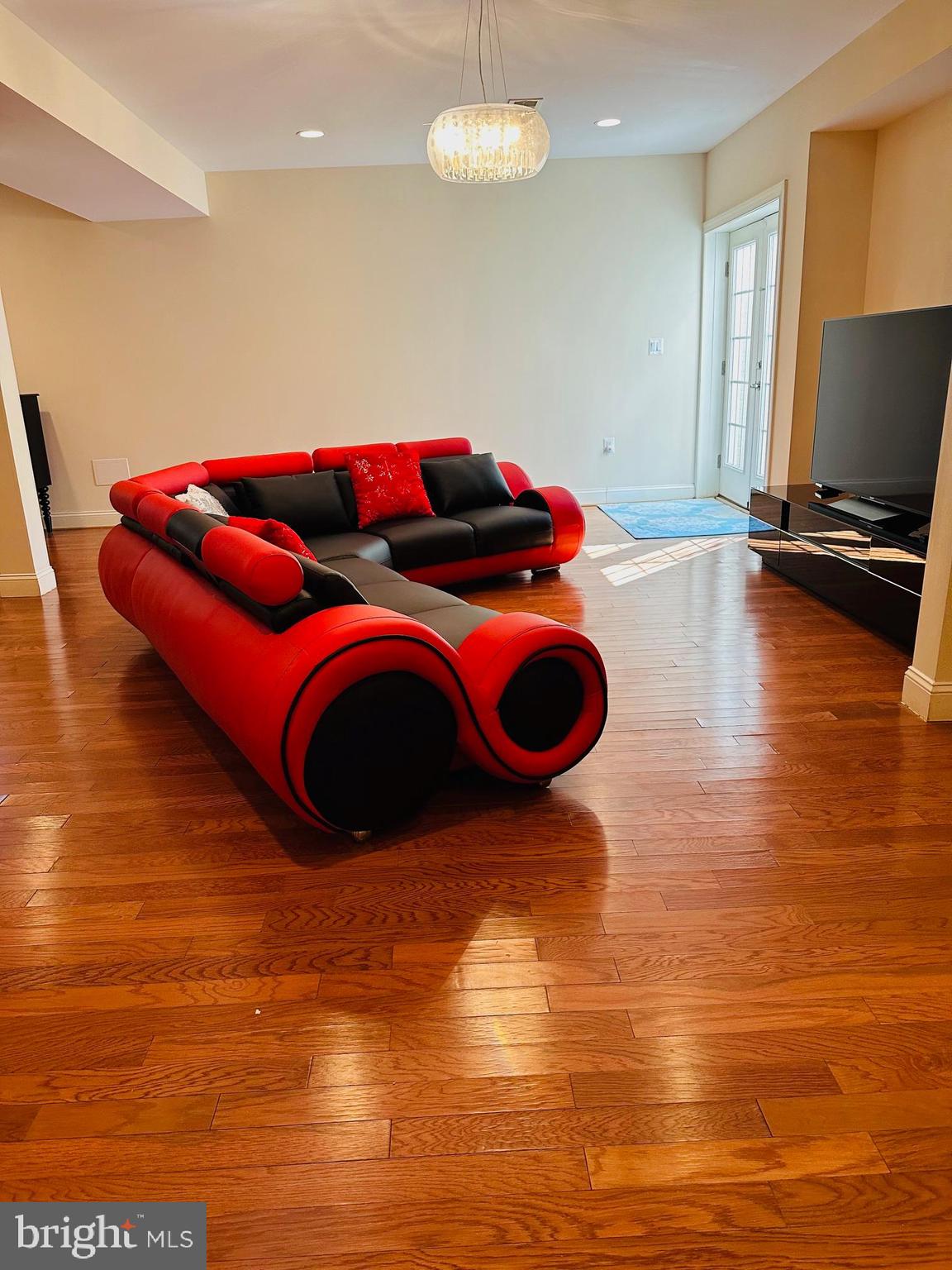 6413 Divine Street McLean, VA 22101 - Photo 49 of 60 a living room with hard wood floors and a table