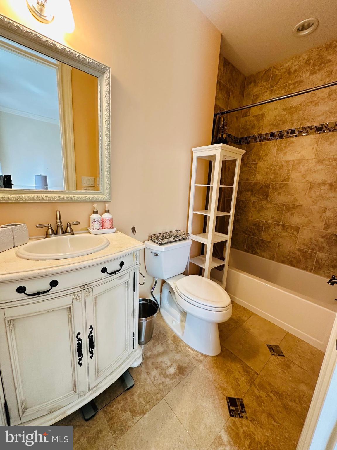 6413 Divine Street McLean, VA 22101 - Photo 60 of 60 a bathroom with a sink toilet and shower