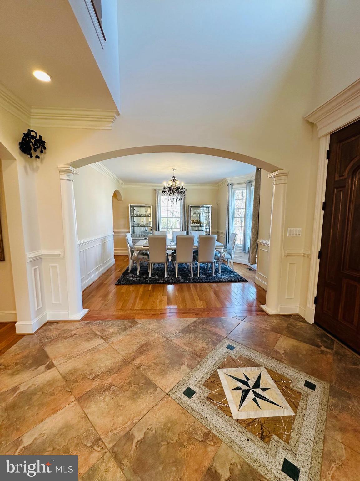 6413 Divine Street McLean, VA 22101 - Photo 10 of 60 a living room with furniture flat screen tv and a table