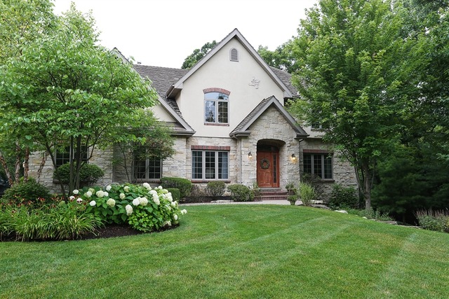 9032 Wolf Road Willow Springs, IL 60527 - Photo 1 of 25 a front view of a house with a garden and plants