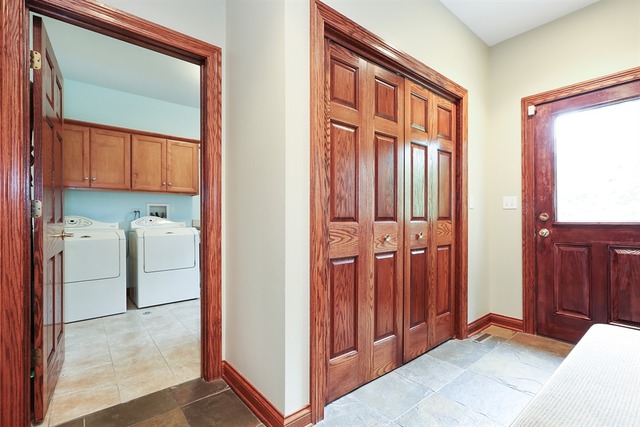 9032 Wolf Road Willow Springs, IL 60527 - Photo 11 of 25 a view of a hallway with washer and dryer