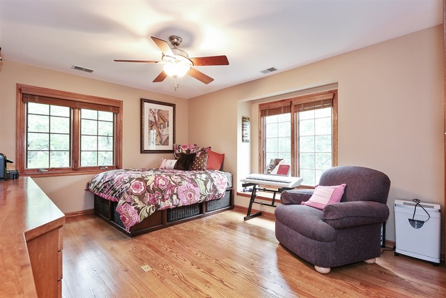 9032 Wolf Road Willow Springs, IL 60527 - Photo 15 of 25 a bedroom with a large bed and a large window