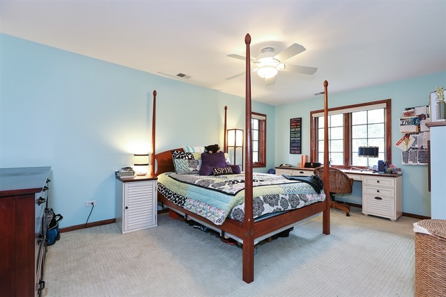 9032 Wolf Road Willow Springs, IL 60527 - Photo 17 of 25 a bed room with furniture and a window