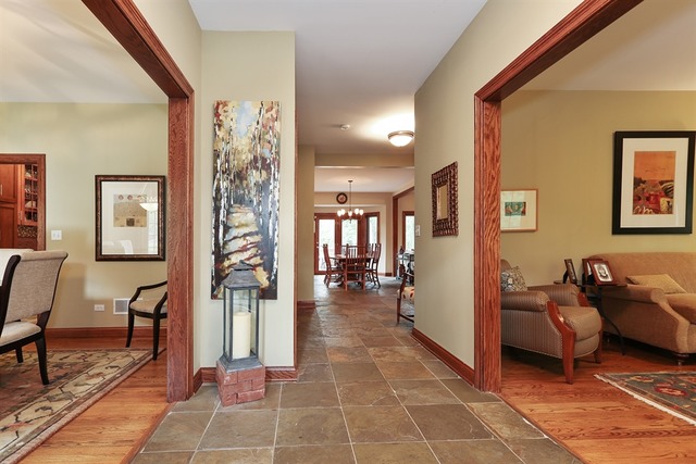 9032 Wolf Road Willow Springs, IL 60527 - Photo 3 of 25 a living room with furniture and a dining table with bookshelf