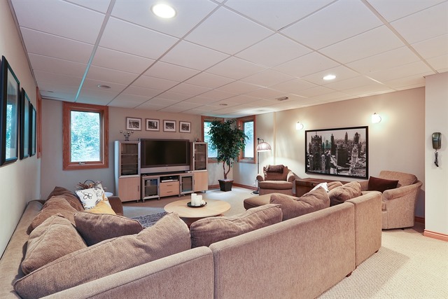 9032 Wolf Road Willow Springs, IL 60527 - Photo 21 of 25 a living room with furniture and a flat screen tv
