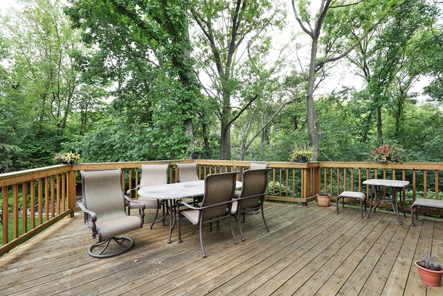 9032 Wolf Road Willow Springs, IL 60527 - Photo 23 of 25 a view of a deck with table and chairs and wooden floor
