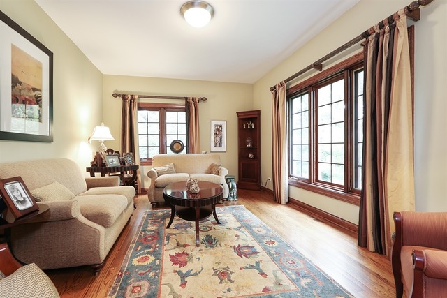 9032 Wolf Road Willow Springs, IL 60527 - Photo 4 of 25 a living room with furniture and a window