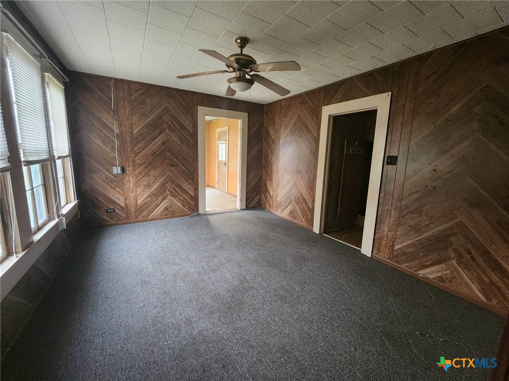 4955 Highway 119 Goliad, TX 77963 - Photo 5 of 7 wooden floor in an empty room with a window