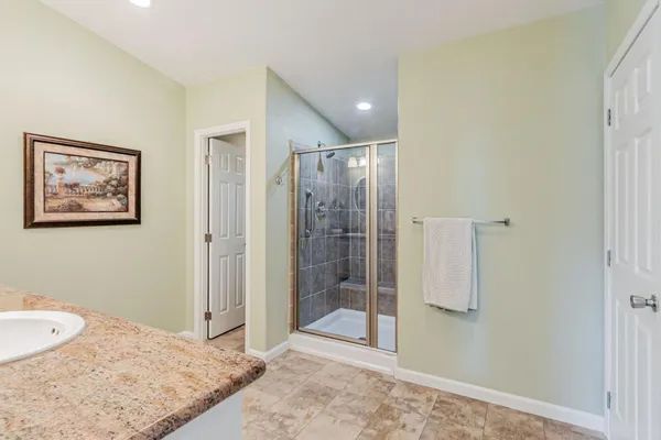 a view of a bathroom with a tub and shower