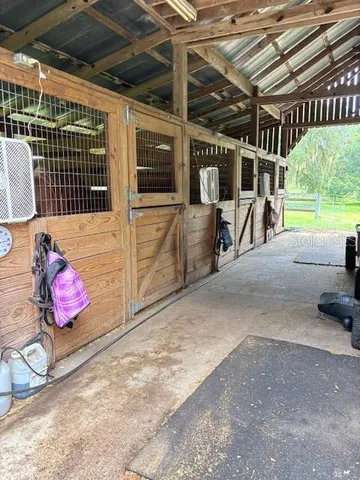 a yard with trees in the background