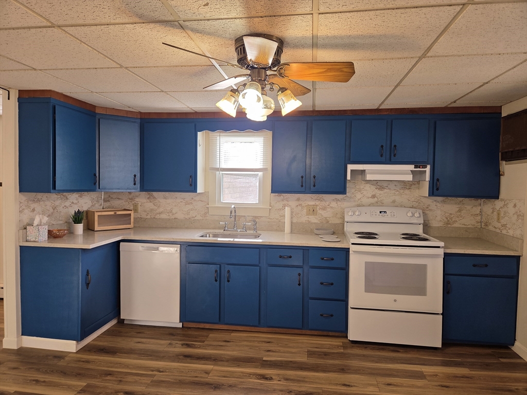 30 Wilde Avenue, Unit A Framingham, MA 01702 - Photo 5 of 18 a kitchen with a stove a sink and a window