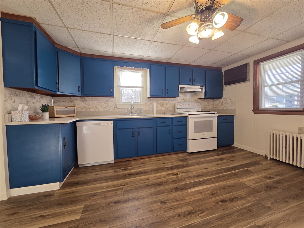 30 Wilde Avenue, Unit A Framingham, MA 01702 - Photo 8 of 18 a kitchen with stainless steel appliances granite countertop a stove cabinets and wooden floor