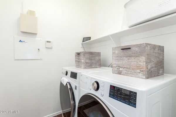 a utility room with dryer and washer