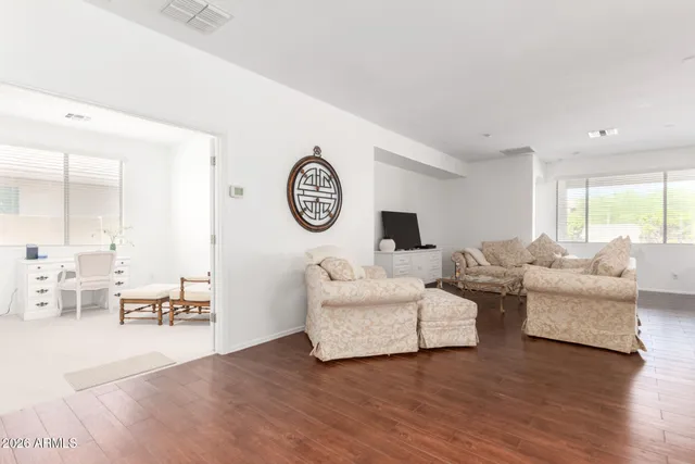a living room with furniture and a large window