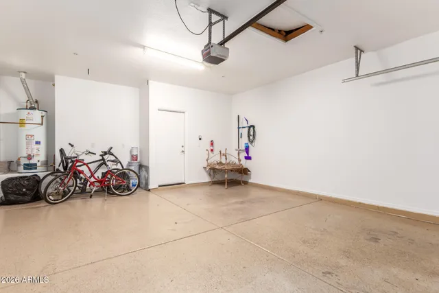 a view of a garage with rack and bicycle