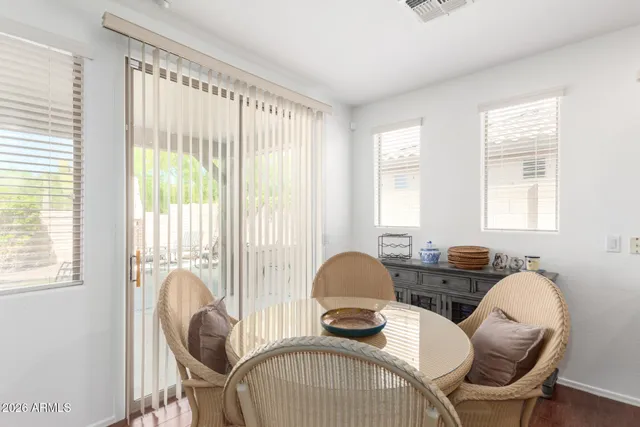 a view of a dining room with furniture and windows