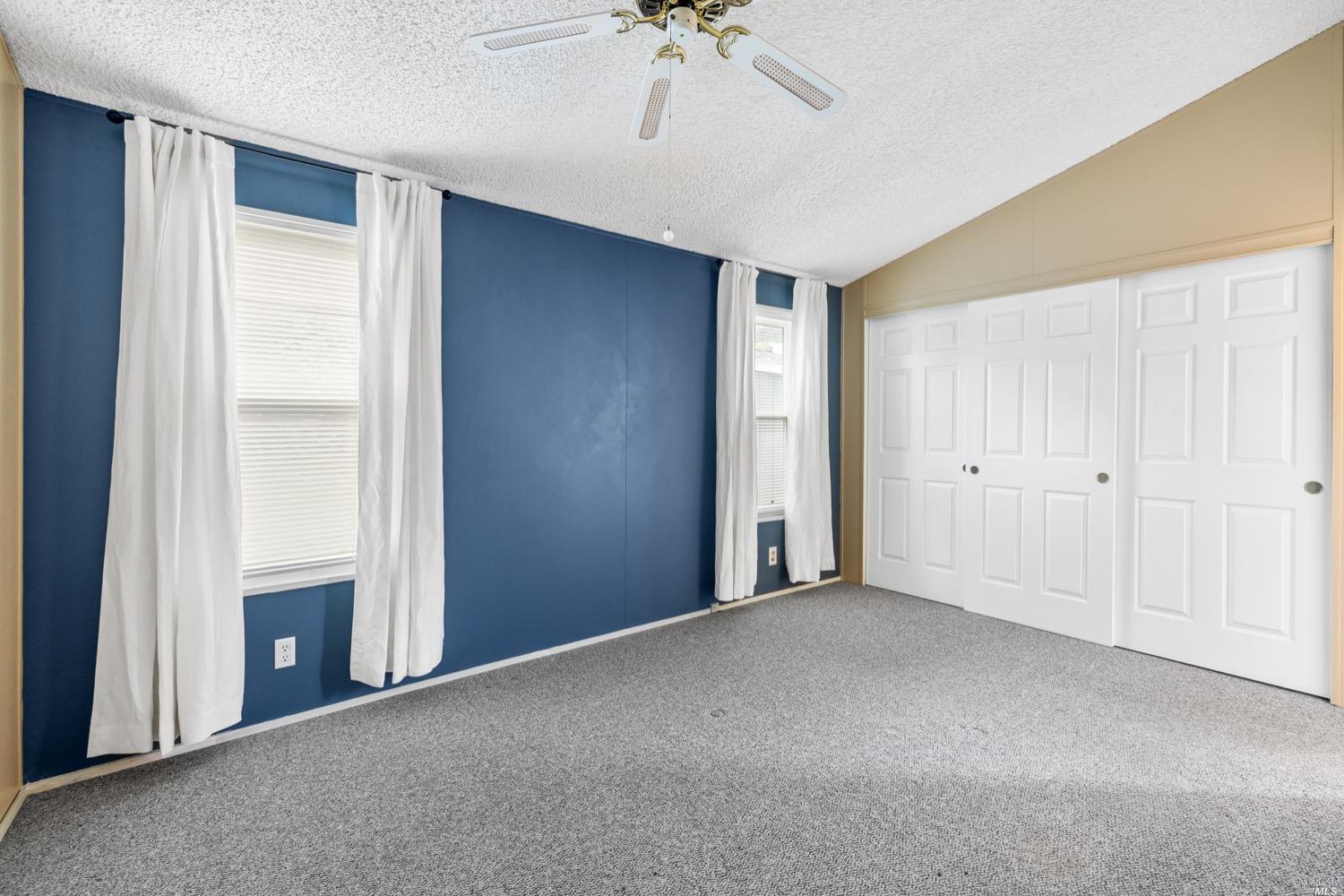 259 Hermosa Circle Santa Rosa, CA 95409 - Photo 22 of 50 Main bedroom with a wall of closet space that includes a closet organizing system. Digitally altered.