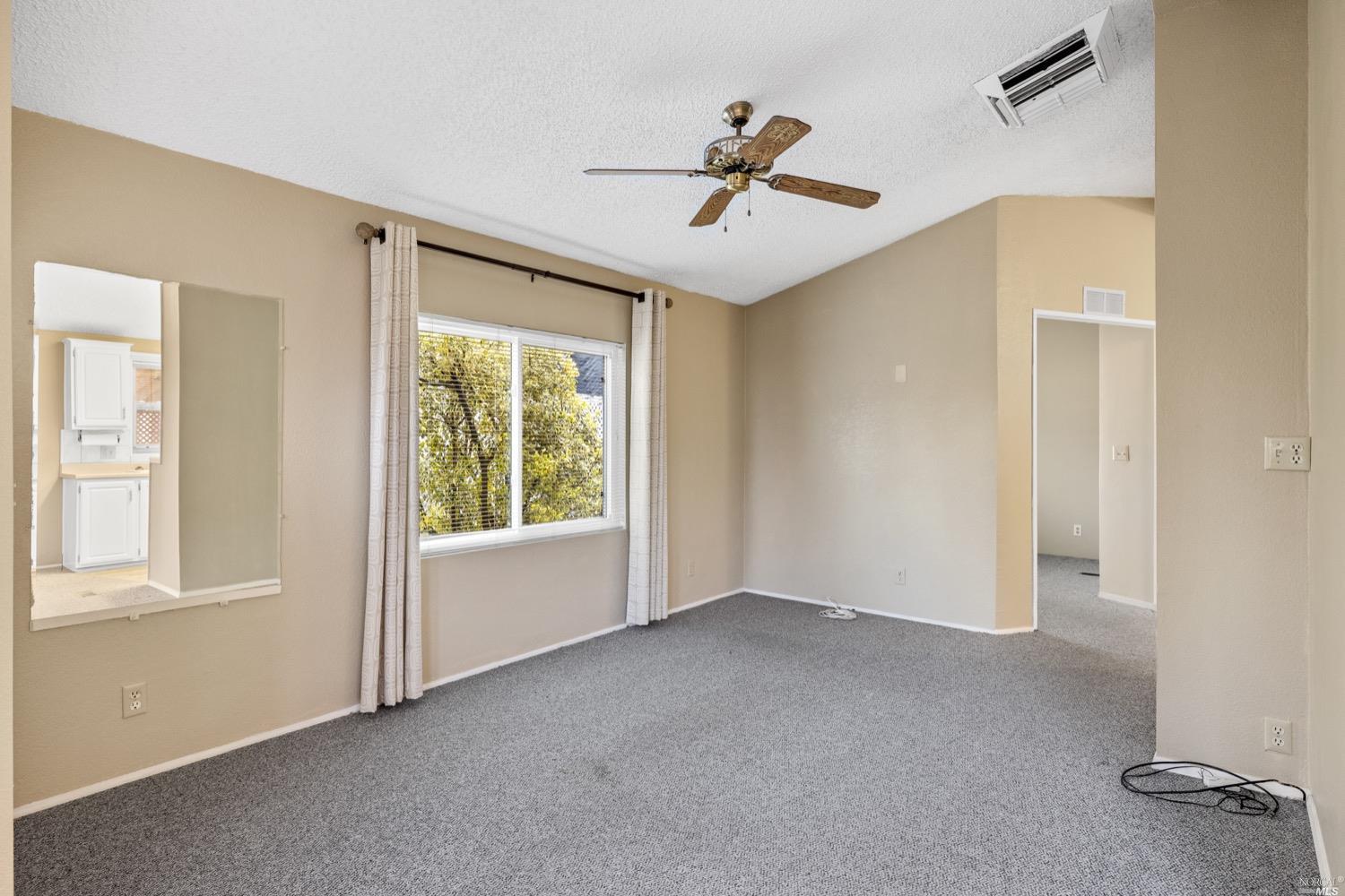 259 Hermosa Circle Santa Rosa, CA 95409 - Photo 8 of 50 Living room with a ceiling fan. Digitally altered.