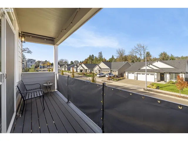 a view of a balcony with chairs