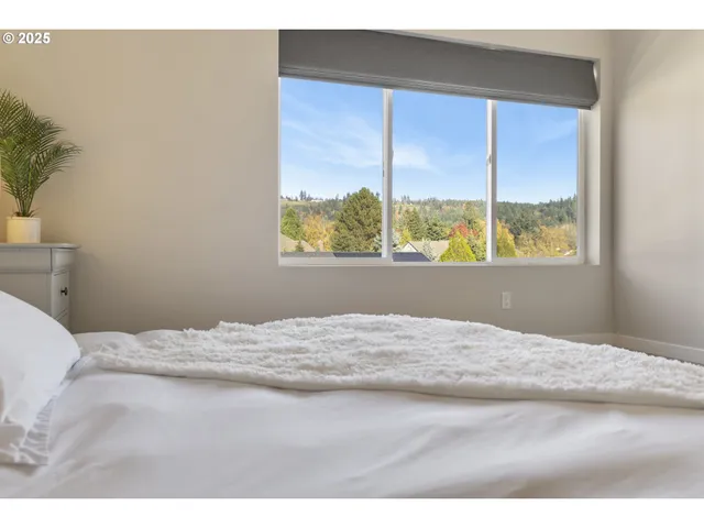 a view of a bedroom and a window
