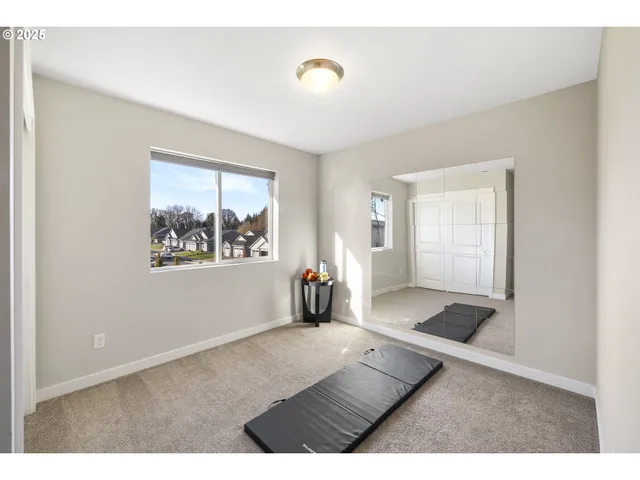 a view of an empty room and window