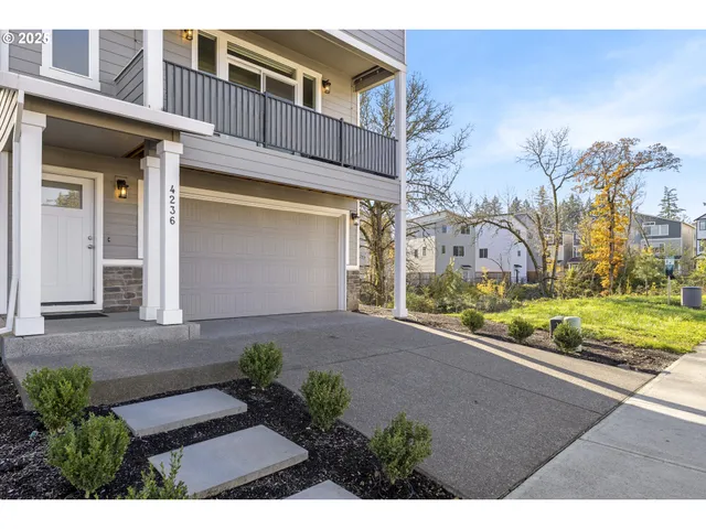 a view of a brick house with a yard