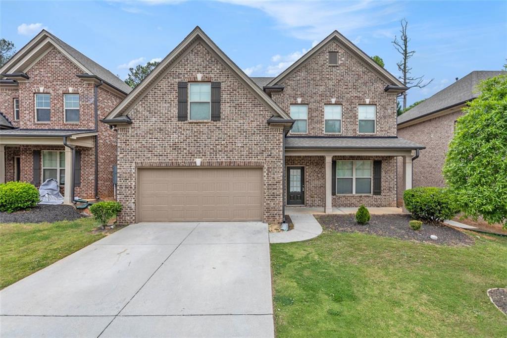 390 Serenity Point Lawrenceville, GA 30046 - Photo 1 of 1 front view of a house with yard