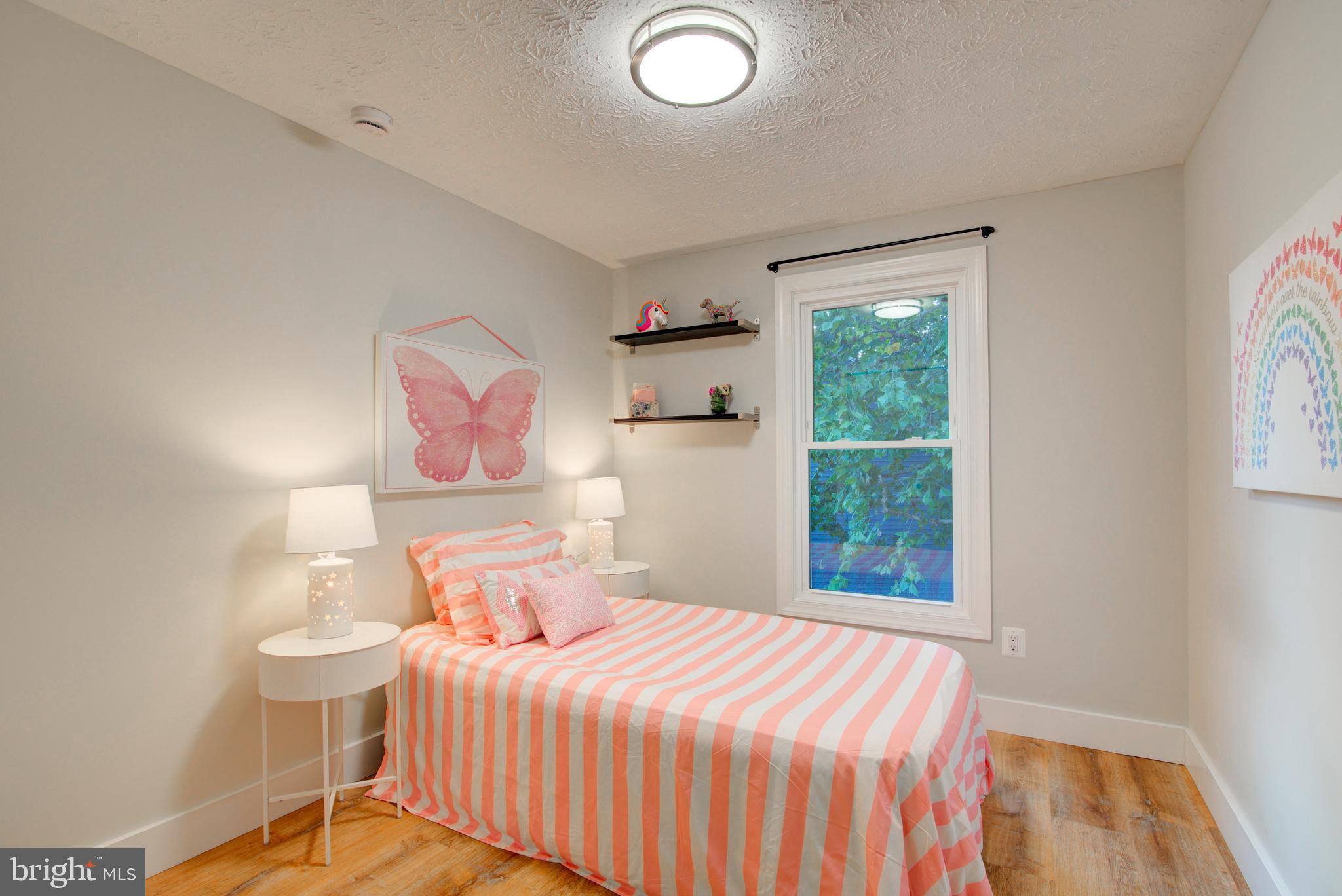 1551 Poplar Grove Drive Reston, VA 20194 - Photo 14 of 24 a bedroom with a bed and a window