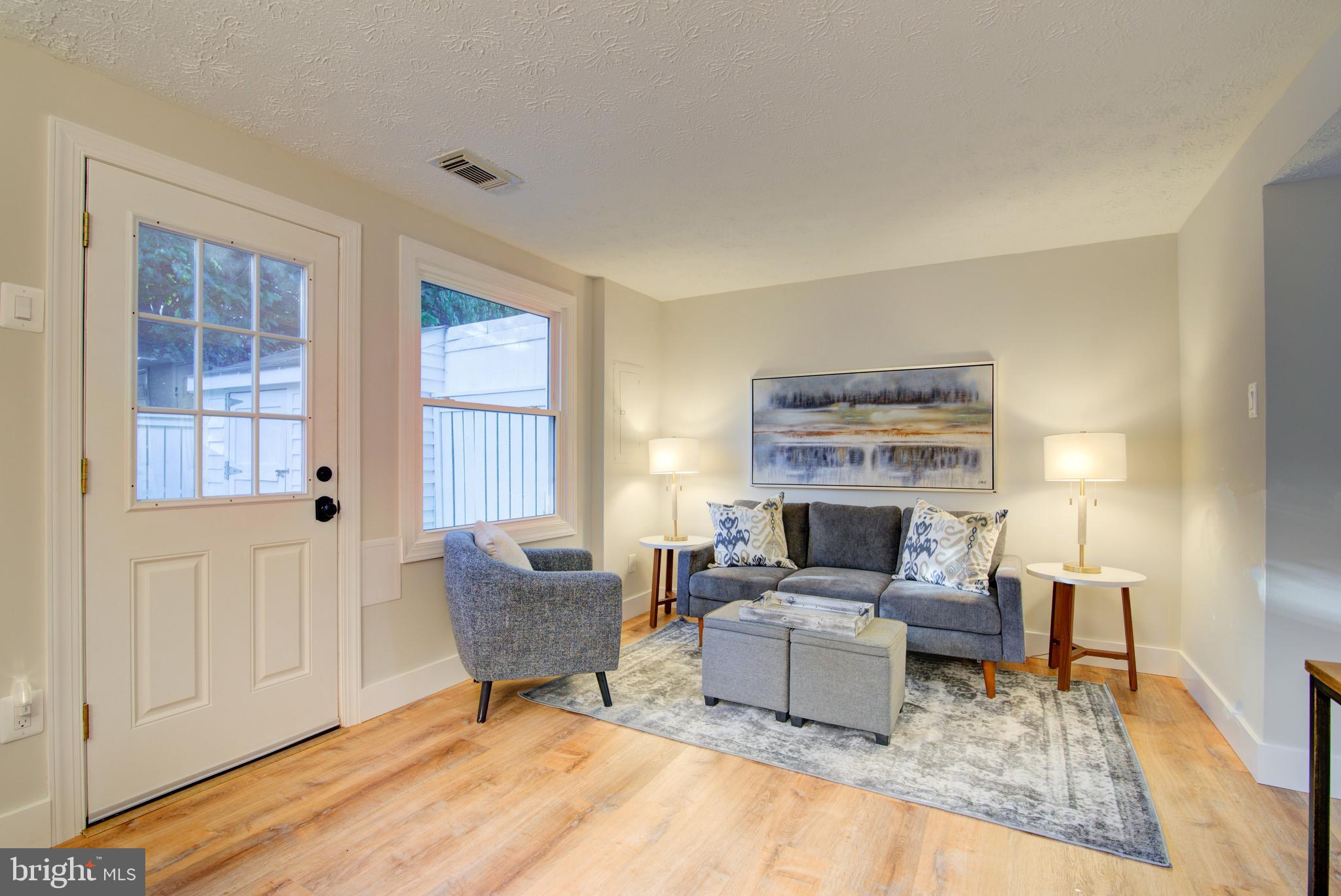 1551 Poplar Grove Drive Reston, VA 20194 - Photo 7 of 24 a living room with furniture and a fireplace