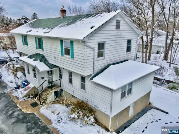a aerial view of a house with a yard