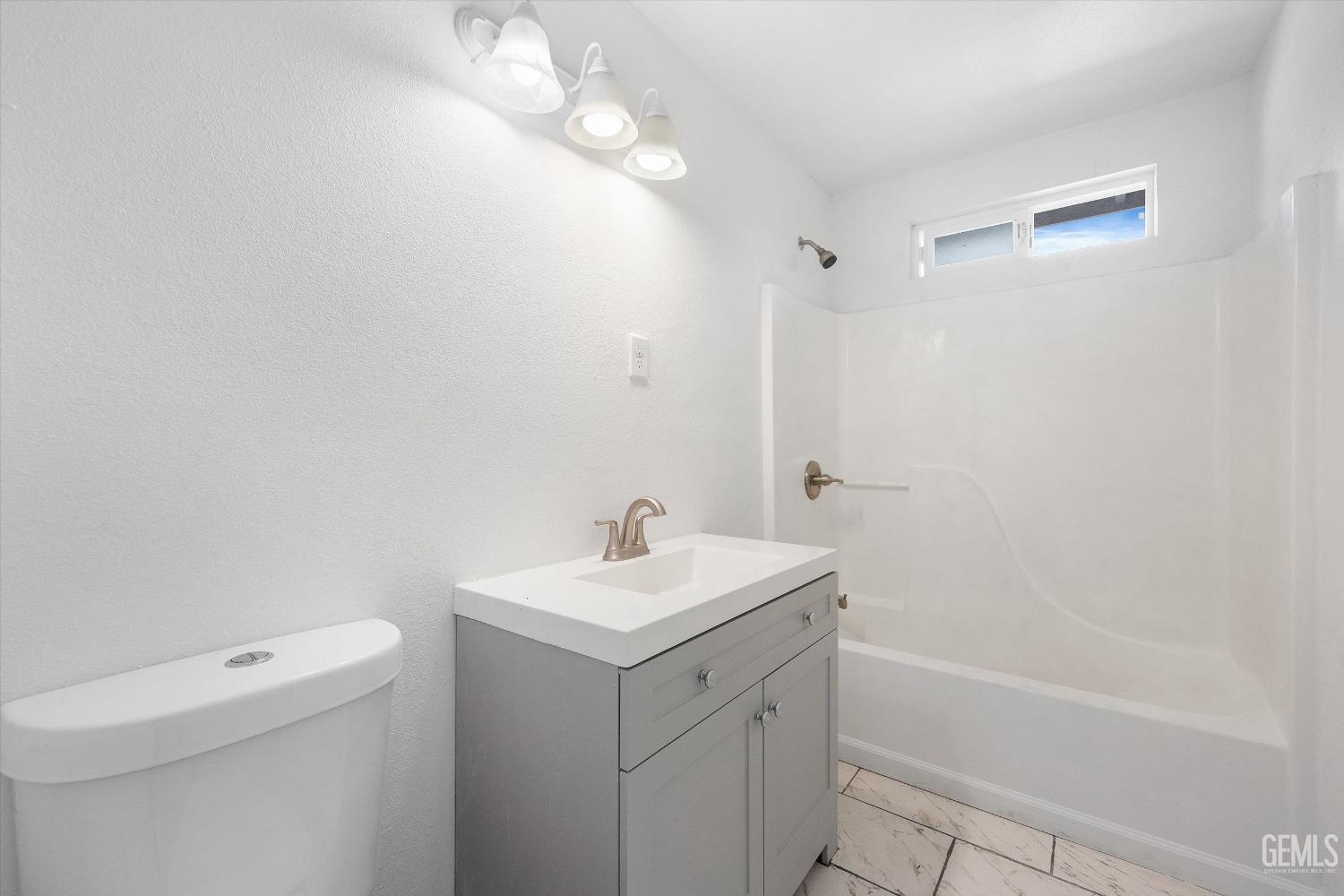 Undisclosed Address Bakersfield, CA 93306 - Photo 17 of 26 a bathroom with a sink a toilet and shower