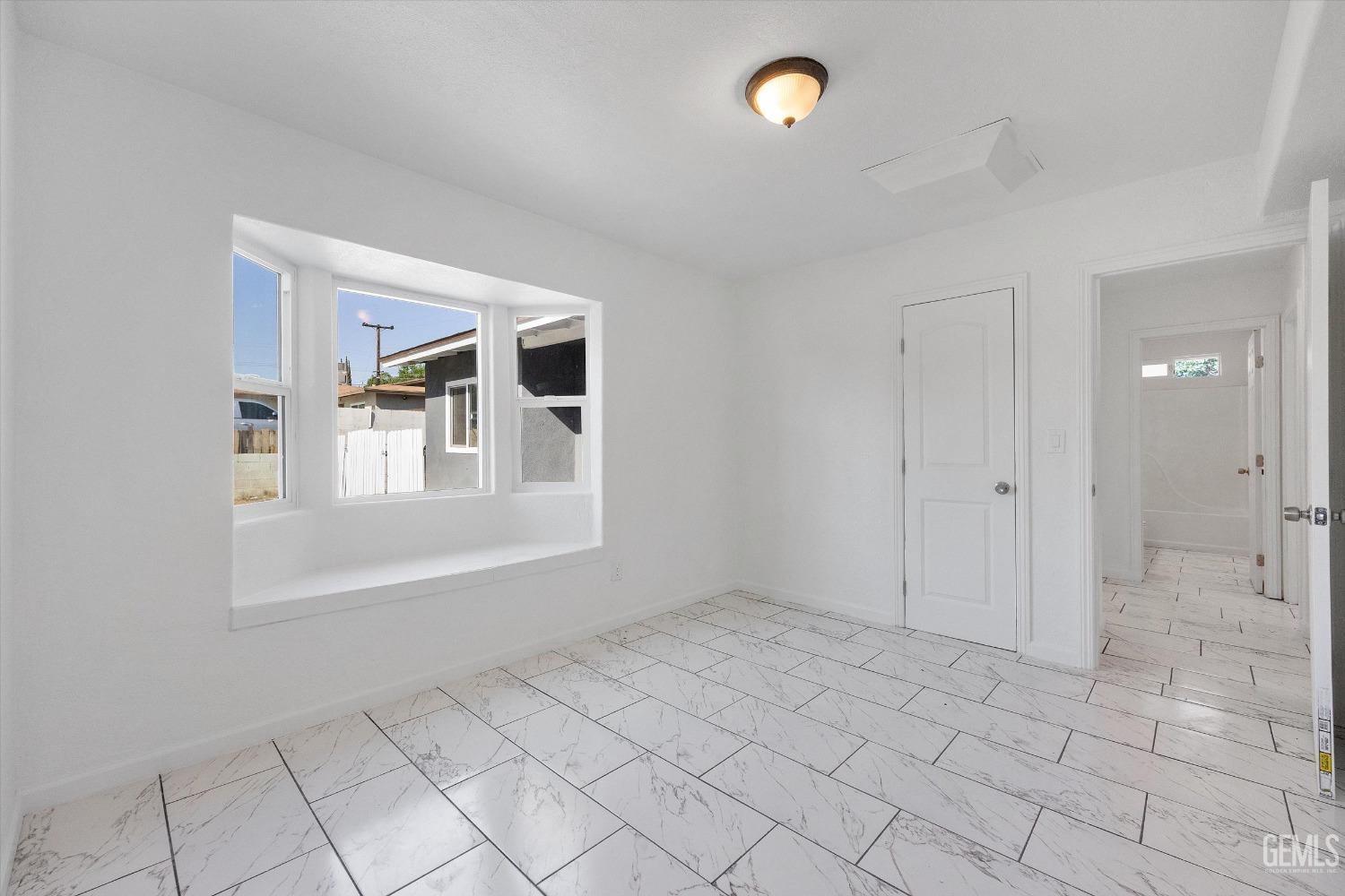 Undisclosed Address Bakersfield, CA 93306 - Photo 18 of 26 a view of an empty room with a window