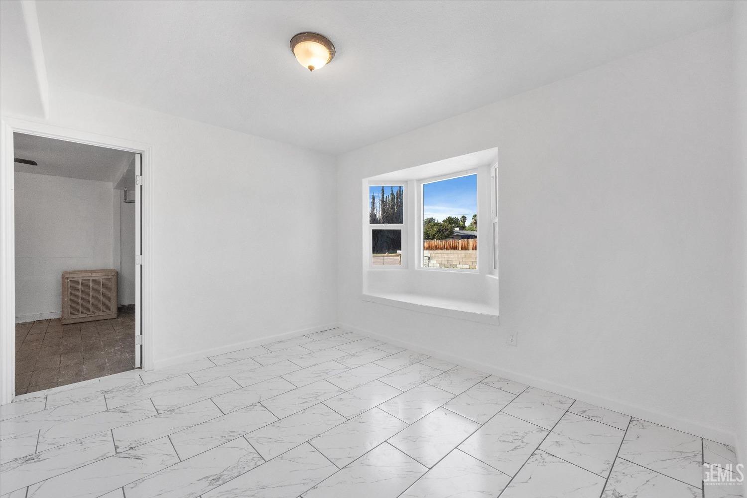 Undisclosed Address Bakersfield, CA 93306 - Photo 19 of 26 an empty room with windows