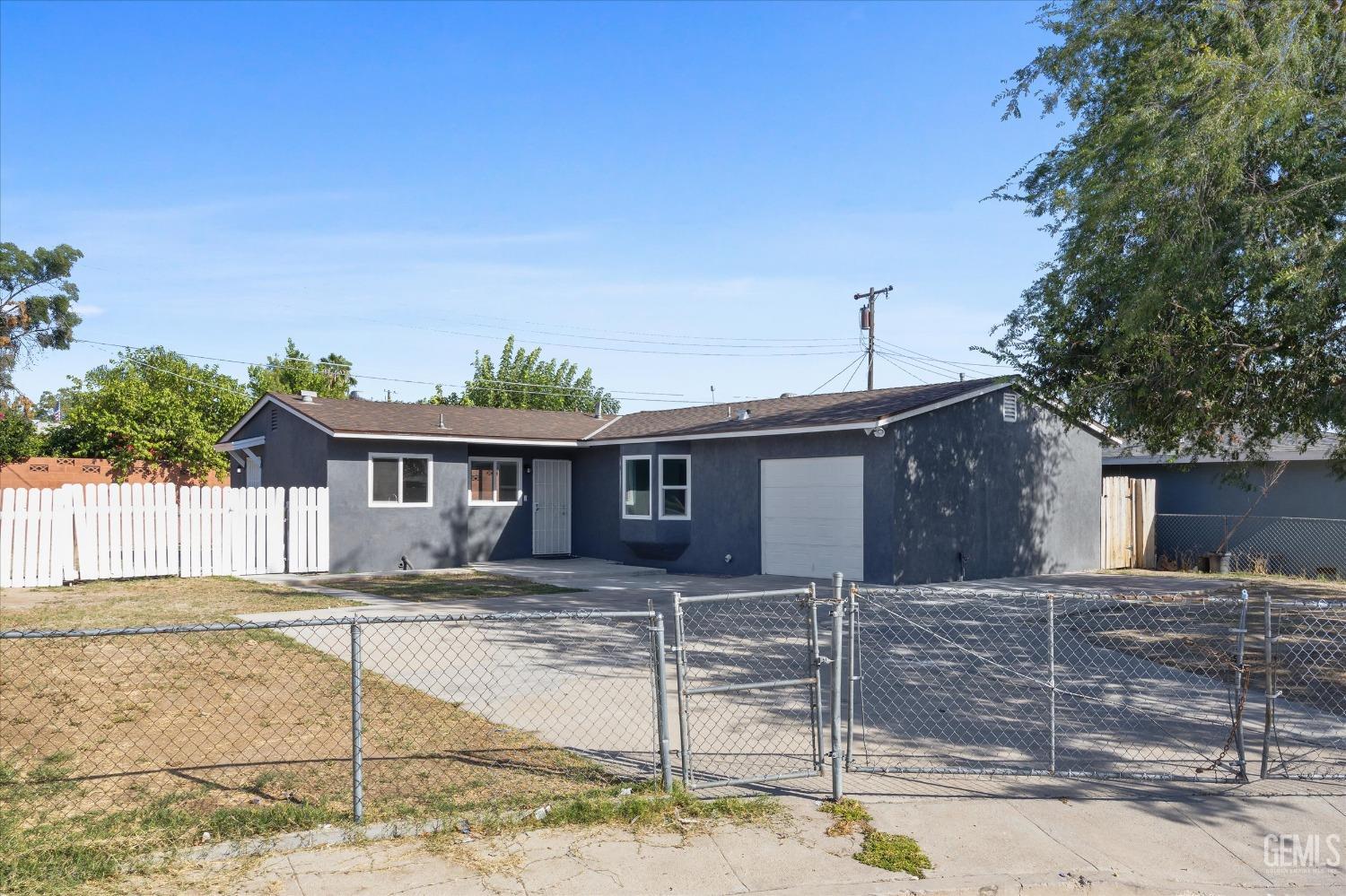 Undisclosed Address Bakersfield, CA 93306 - Photo 2 of 26 a house that has a tree in front of it