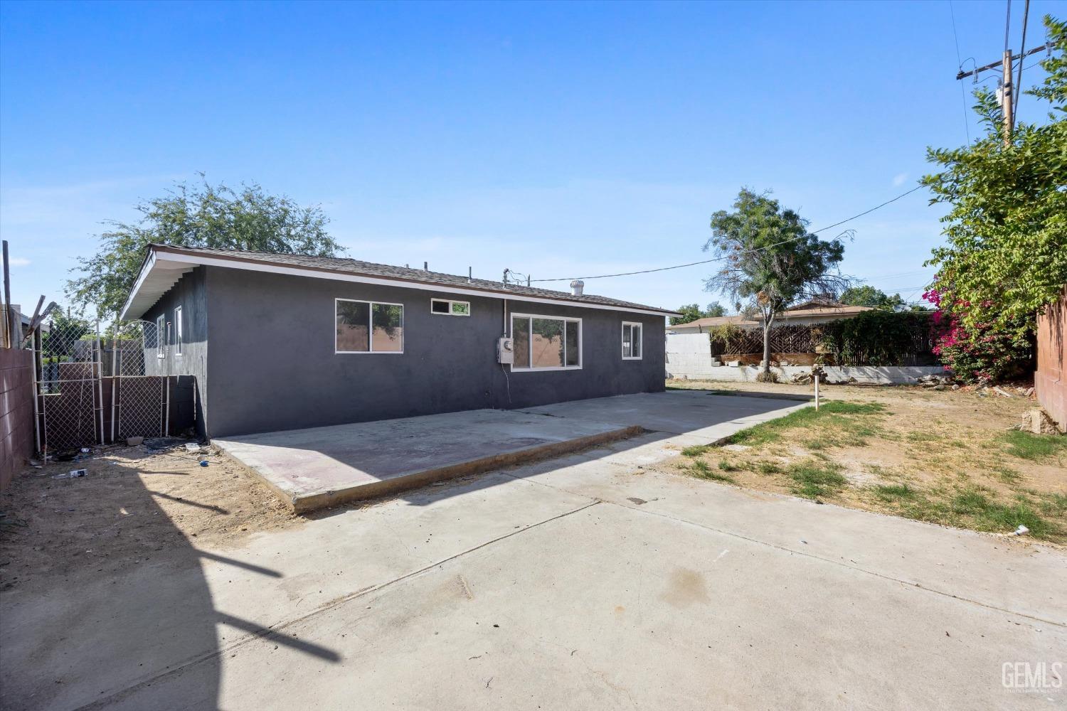 Undisclosed Address Bakersfield, CA 93306 - Photo 25 of 26 a backyard of a house with large trees and outdoor space