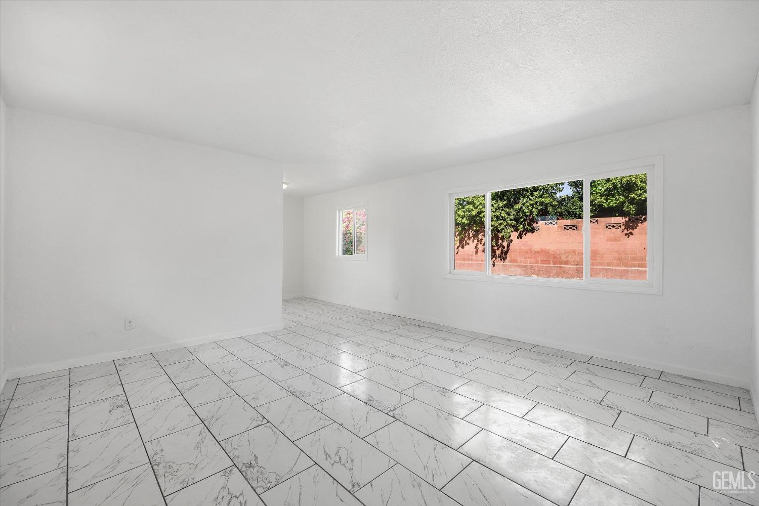 Undisclosed Address Bakersfield, CA 93306 - Photo 8 of 26 an empty room with windows