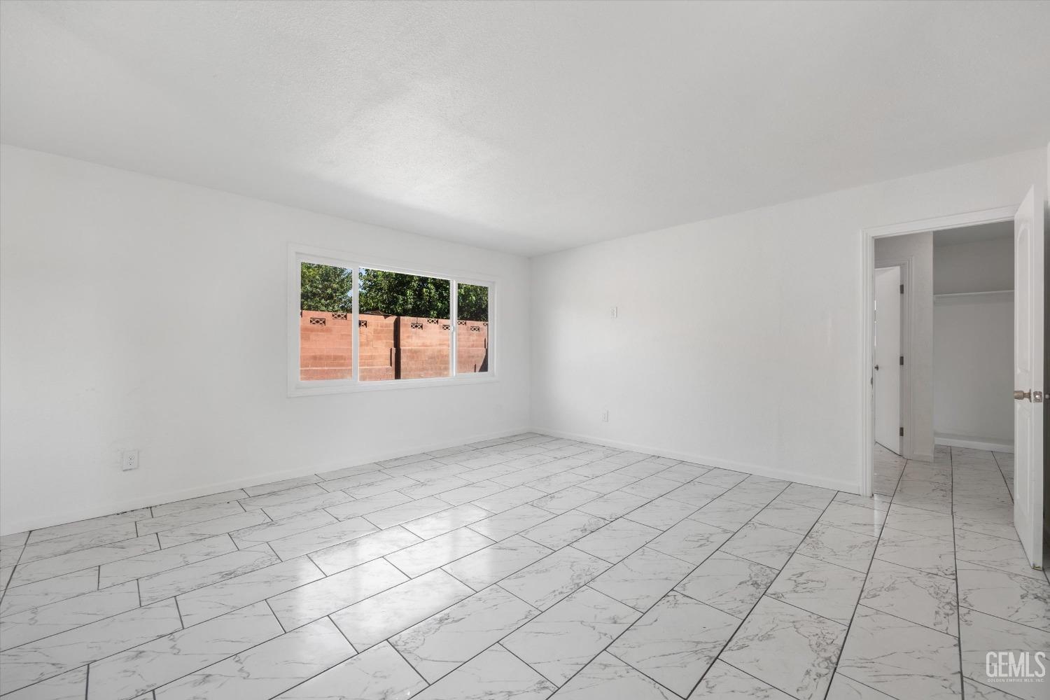 Undisclosed Address Bakersfield, CA 93306 - Photo 9 of 26 an empty room with windows
