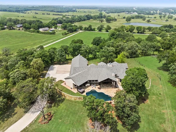 an aerial view of a house with a garden
