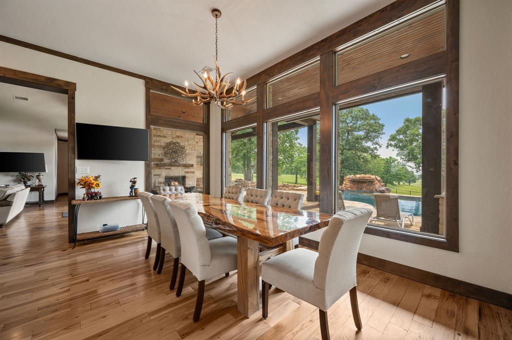248 Howard Road Valley View, TX 76272 - Photo 17 of 40 a view of a dining room with furniture window and wooden floor