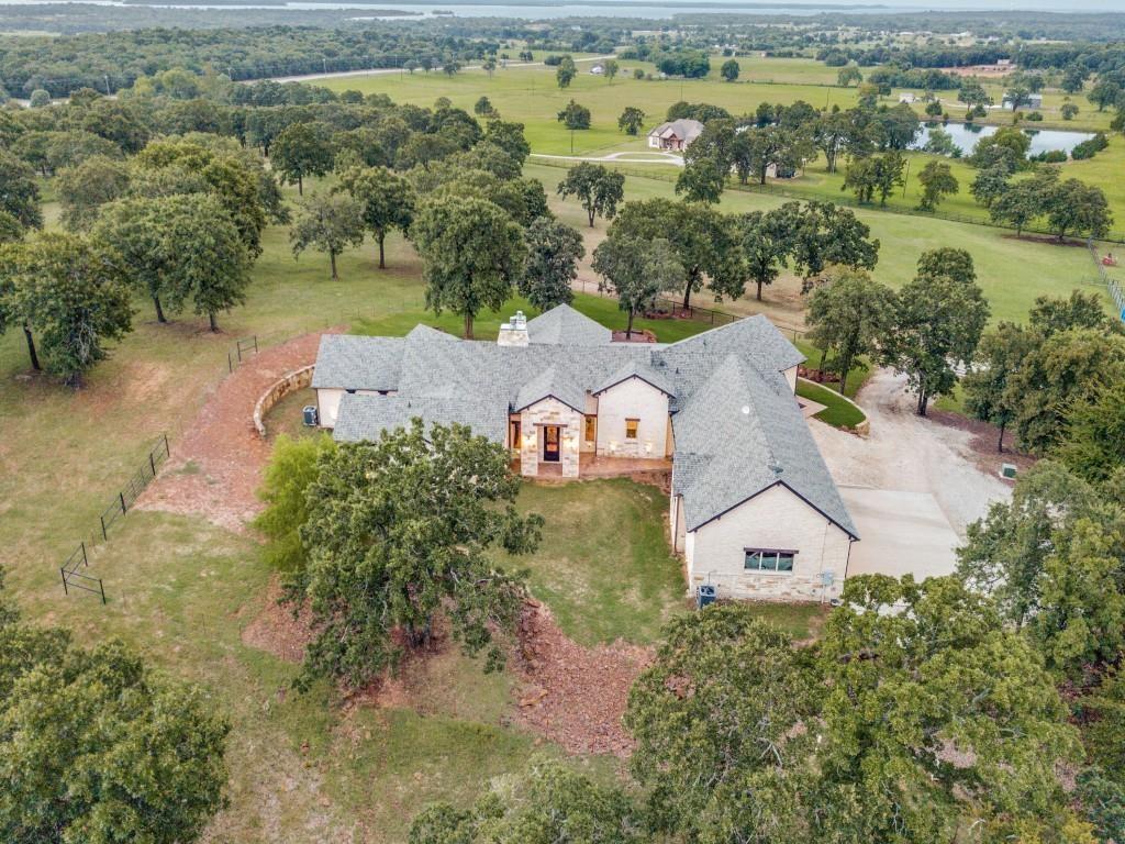 248 Howard Road Valley View, TX 76272 - Photo 2 of 40 an aerial view of a house with a garden