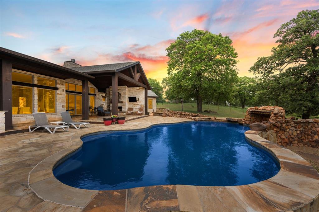 248 Howard Road Valley View, TX 76272 - Photo 35 of 40 a swimming pool with outdoor seating