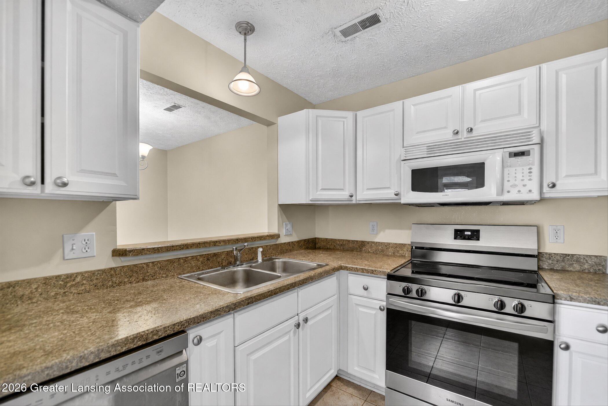 1337 Coolidge Road, Unit 16 East Lansing, MI 48823 - Photo 10 of 31 10-1337-Coolidge-Rd-WindowStill