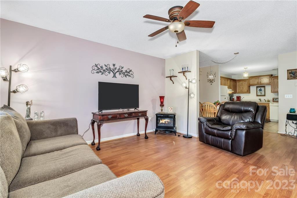 11 Krista Circle, Unit E Candler, NC 28715 - Photo 11 of 25 a living room with furniture and a flat screen tv