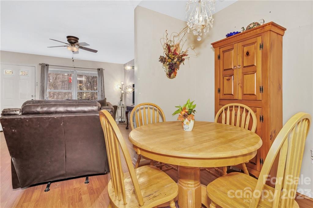 11 Krista Circle, Unit E Candler, NC 28715 - Photo 13 of 25 a dining room with furniture and chandelier