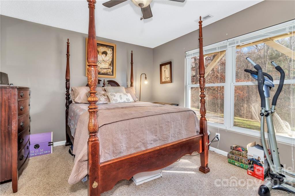 11 Krista Circle, Unit E Candler, NC 28715 - Photo 23 of 25 a bedroom with a bed and a window