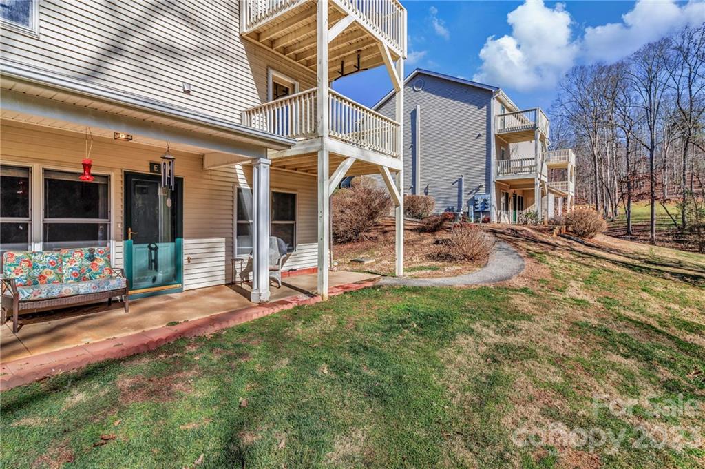 11 Krista Circle, Unit E Candler, NC 28715 - Photo 4 of 25 a view of a house with backyard and sitting area