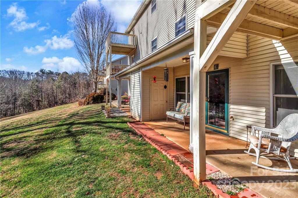 11 Krista Circle, Unit E Candler, NC 28715 - Photo 5 of 25 a view of a house with backyard and sitting area