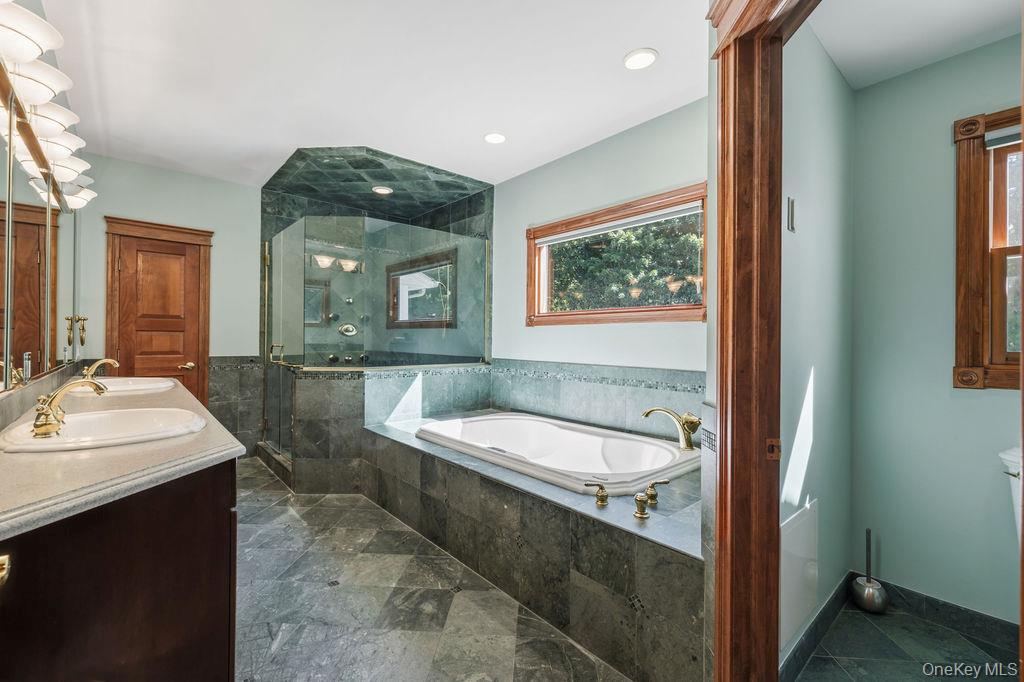 10 Rockingham Road Spring Valley, NY 10977 - Photo 14 of 35 Jetted tub, tiled shower, two sinks, private toilet stall